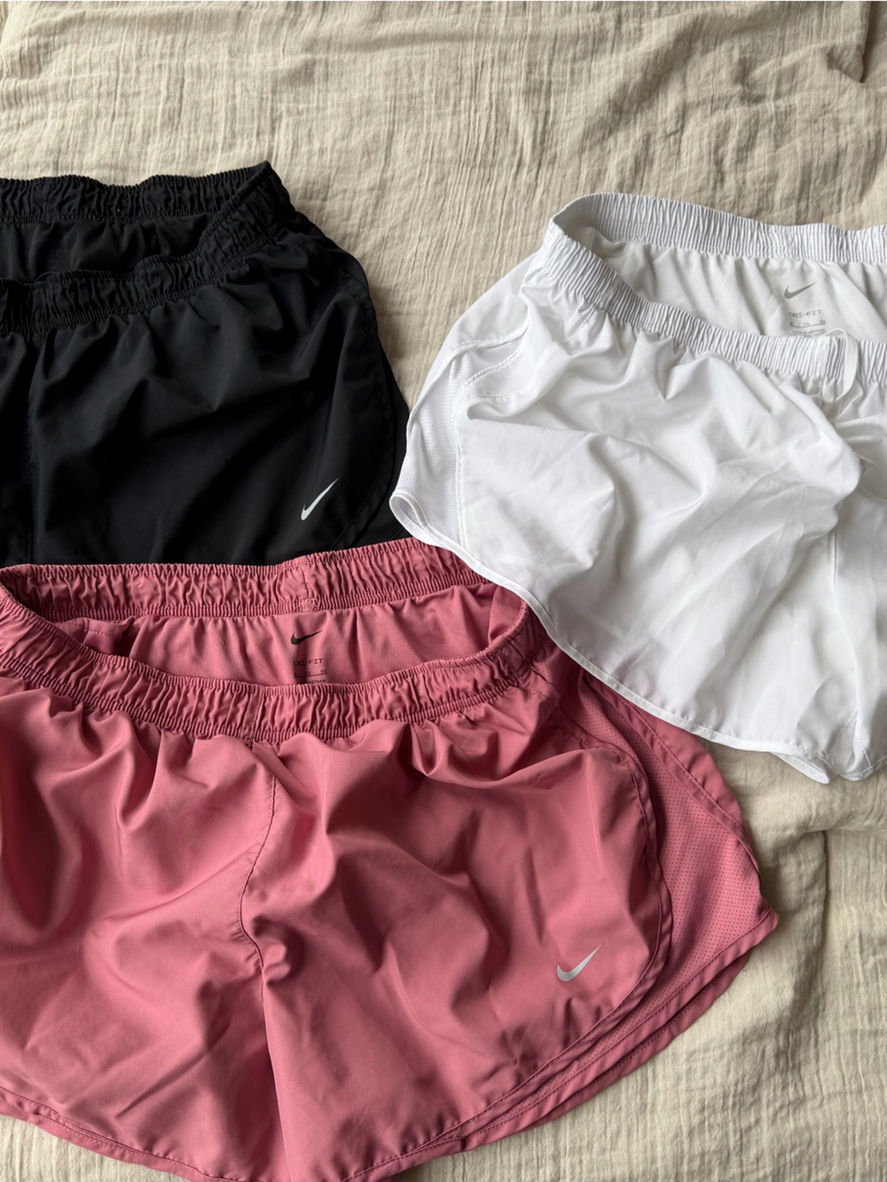 Nike women’s Shorts Trio in Pink, White & Black